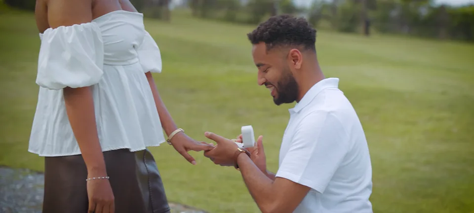 The ring held out from its box, his hand reaching for hers
